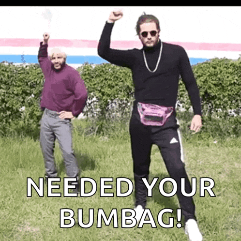 two men are standing in a grassy field with the words needed your bumbag