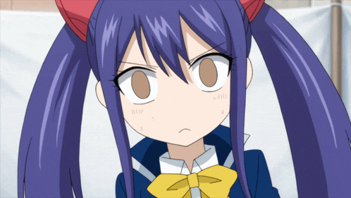 a girl with purple hair and a yellow bow is making a funny face
