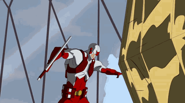 a cartoon character in a red and white suit is holding a stick
