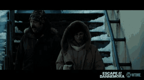 a showtime ad for escape at dannemora shows a man and a woman walking down stairs in the snow