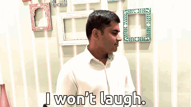 a man says i won 't laugh while standing in front of a striped wall