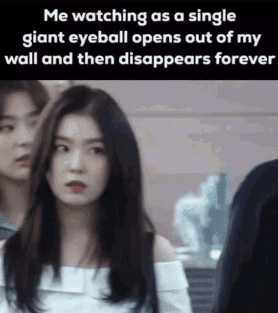 a girl is watching a single giant eyeball open out of her wall and then disappears forever .