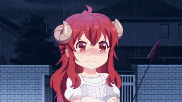 a girl with horns on her head is standing in the rain