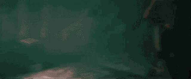 a bright white light is shining through a dark room