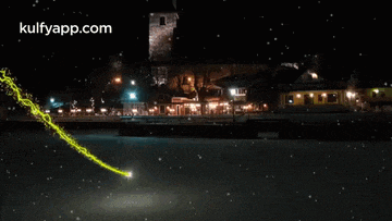 a picture of a city at night with the website kulfyapp.com in the upper right corner