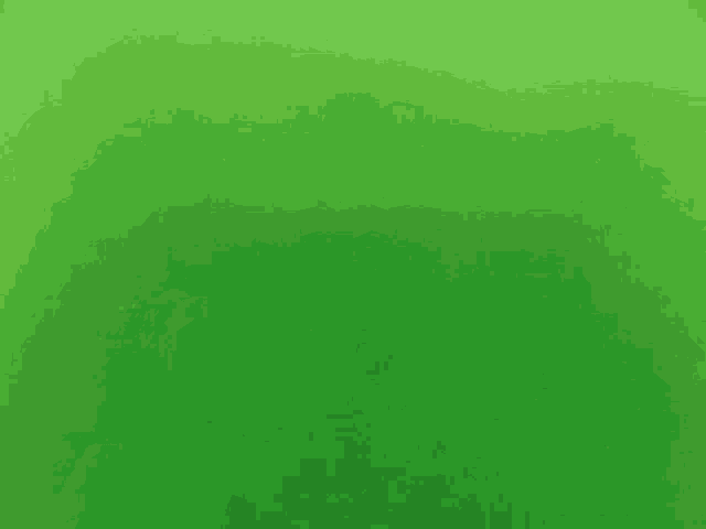 a green screen with a purple object in the middle