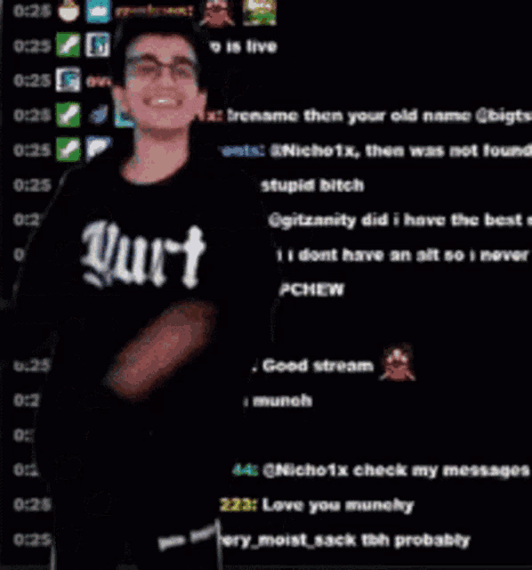 a man with glasses is standing in front of a screen with a bunch of messages
