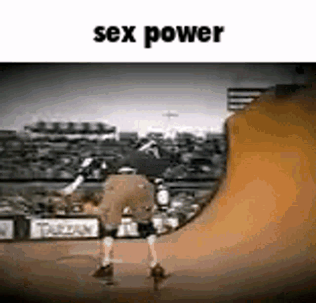 a man is riding a skateboard down a ramp and the words sex power are above him .