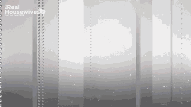 a gray background with a few lines of beads on it