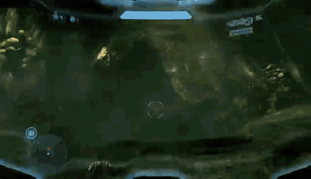 a video game character with glowing eyes and a halo emblem