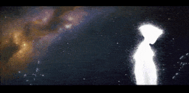 a silhouette of a person standing in a dark space