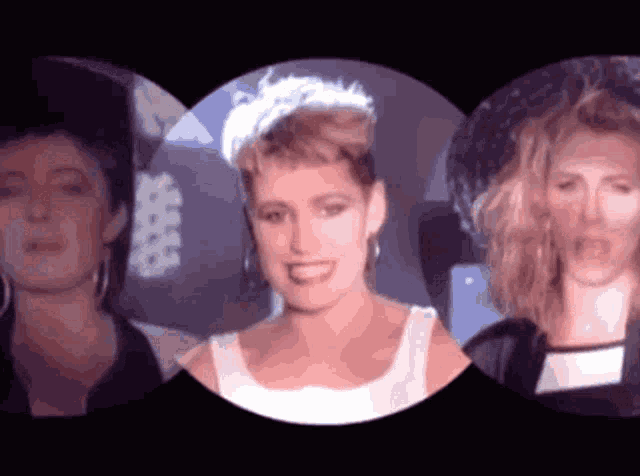 a woman in a white tank top stands in a circle with two other women