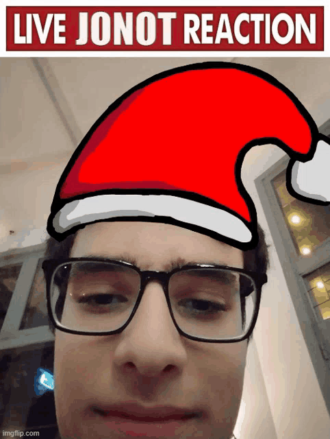 a man wearing glasses and a santa hat with the words " live jonot reaction " behind him