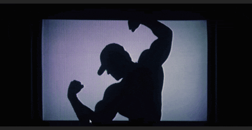 a purple and green silhouette of a person on a tv screen