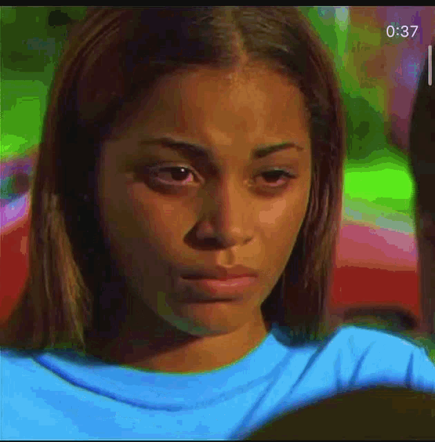 a close up of a woman 's face with the time 0:37 on the bottom
