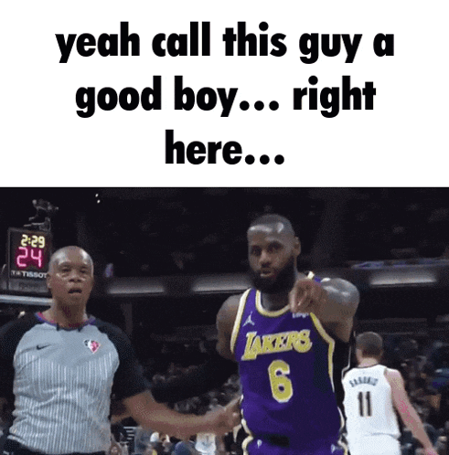 a basketball player in a lakers jersey talks to a referee during a game