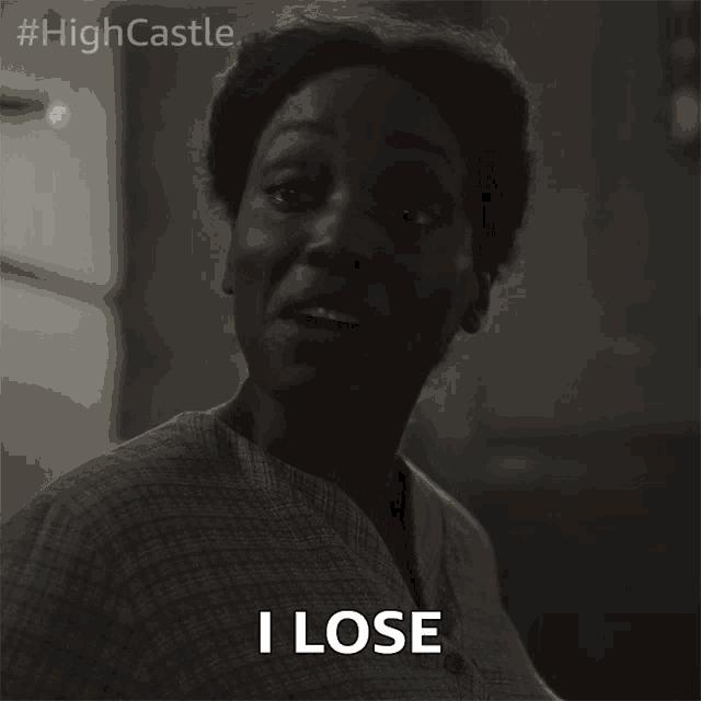 a woman in a plaid shirt says i lose in a black and white photo