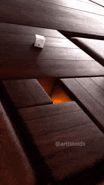 a picture of a wooden table with the hashtag artistoids on the bottom