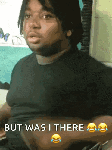 a man in a black shirt is making a funny face with the words but was i there below him