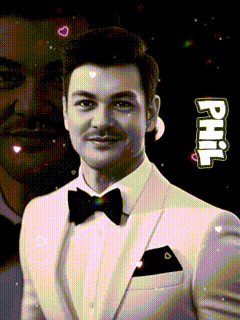 a black and white photo of a man in a tuxedo with the name phil on the bottom right