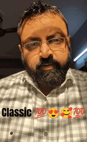a man with glasses and a beard is wearing a shirt that says classic on it