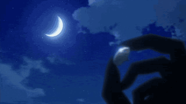 a black haired anime character is laying down and holding a coin