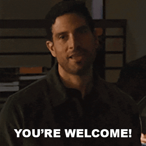 a man says " you 're welcome " while smiling and looking at the camera