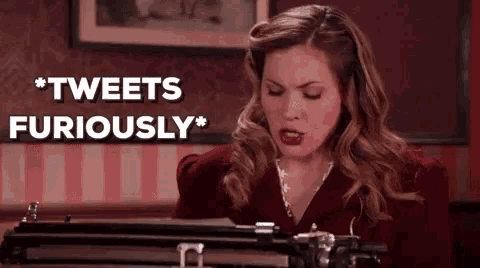 a woman is sitting at a typewriter with her eyes closed and says `` tweets furiously '' .