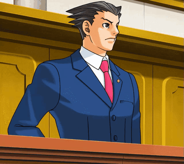 a man in a suit and tie stands in front of a yellow wall