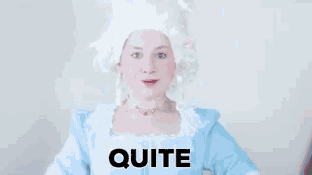 a woman in a wig and blue dress is giving a thumbs up sign .