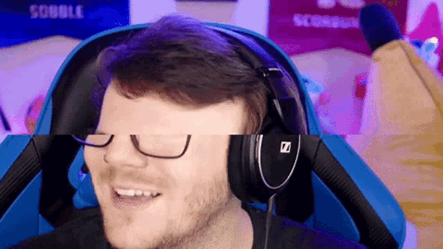 a man wearing glasses and headphones with the letter z on them