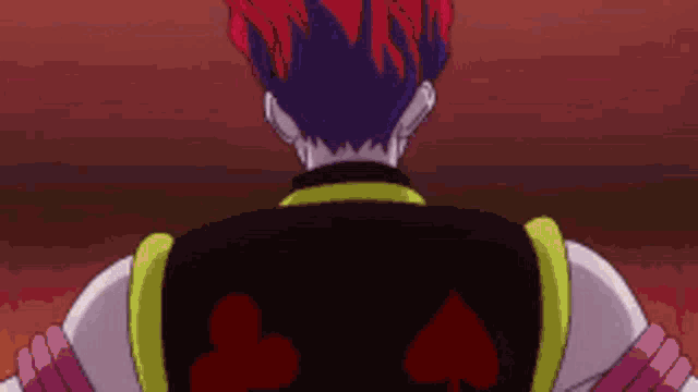 a close up of a person 's back with a playing card design on it .
