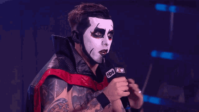 a wrestler says right now while pointing at something