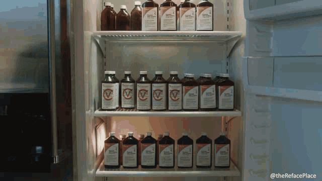 a refrigerator filled with bottles of medicine including tylenol and acetaminophen