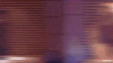 a woman in a black dress is dancing in front of a wall of lights with the hashtag #feelcrystali on the bottom