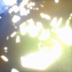a blurred image of a person 's hand with the sun shining through it