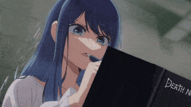 a girl with blue hair is looking at a book titled death note