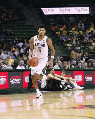 a basketball player with the number 10 on his jersey is running with the ball