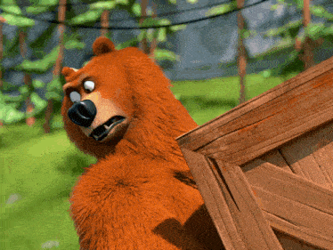 a cartoon bear is standing behind a wooden crate