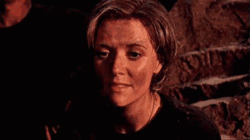 a close up of a woman 's face with the words `` a crush '' written on the bottom .