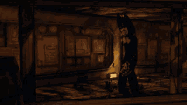 a dark room with a shadow of a person on the wall .