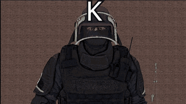 a man wearing a helmet with a letter k on it