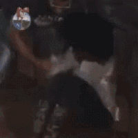 a blurry picture of a man carrying a child on his back
