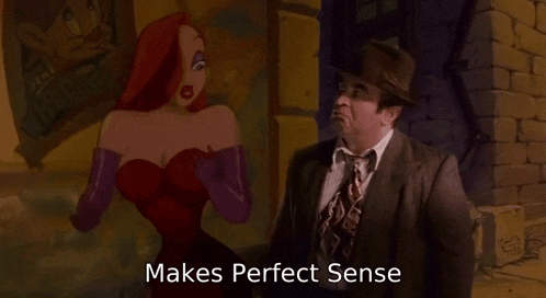 a man in a suit and tie is talking to a woman in a red dress .