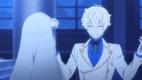 a man in a white suit and blue tie is dancing with a woman
