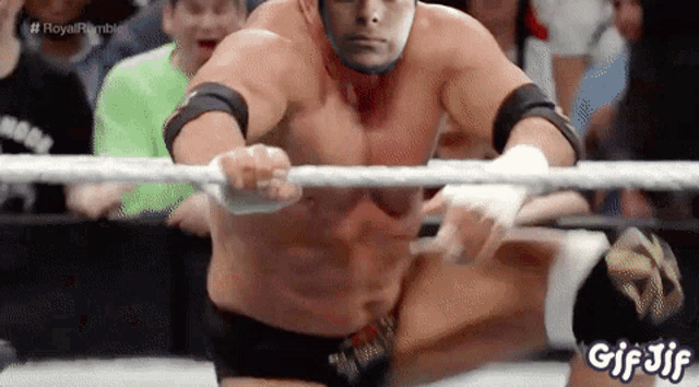 a man in a wrestling ring with the words royal rumble written on the bottom