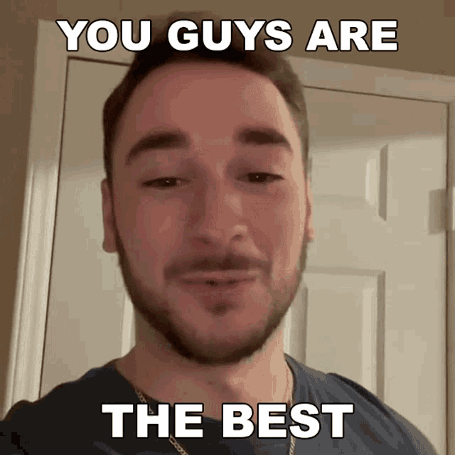 a man with a beard is standing in front of a door with a caption that says you guys are the best