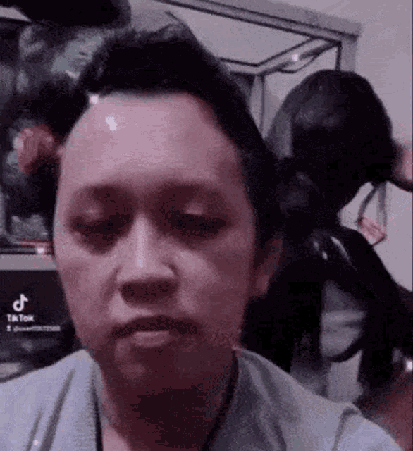 a close up of a person 's face with a wig on .