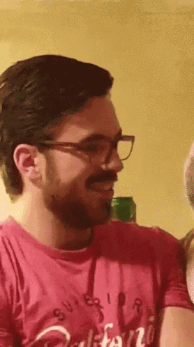 a man wearing glasses and a red shirt with california on it