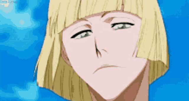 a close up of a person 's face with blonde hair